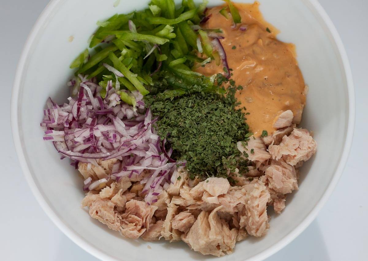 Ingredients to make chipotle tuna salad in a bowl.