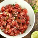 Watermelon feta salad with jalapeno in a bowl on the table.
