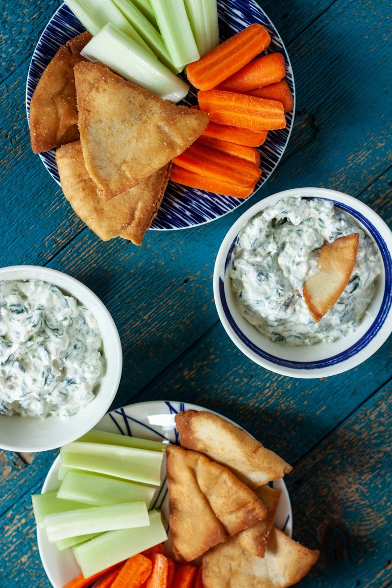 Cold Spinach Dip with pita chips and carrots and celery sticks