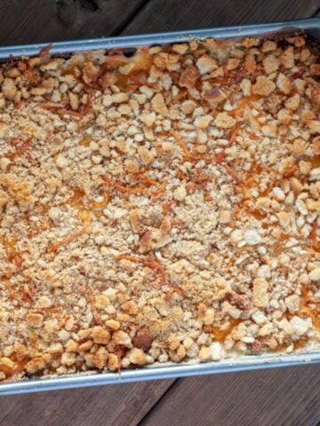 cheesy hash brown potato casserole freshly baked in a pan.