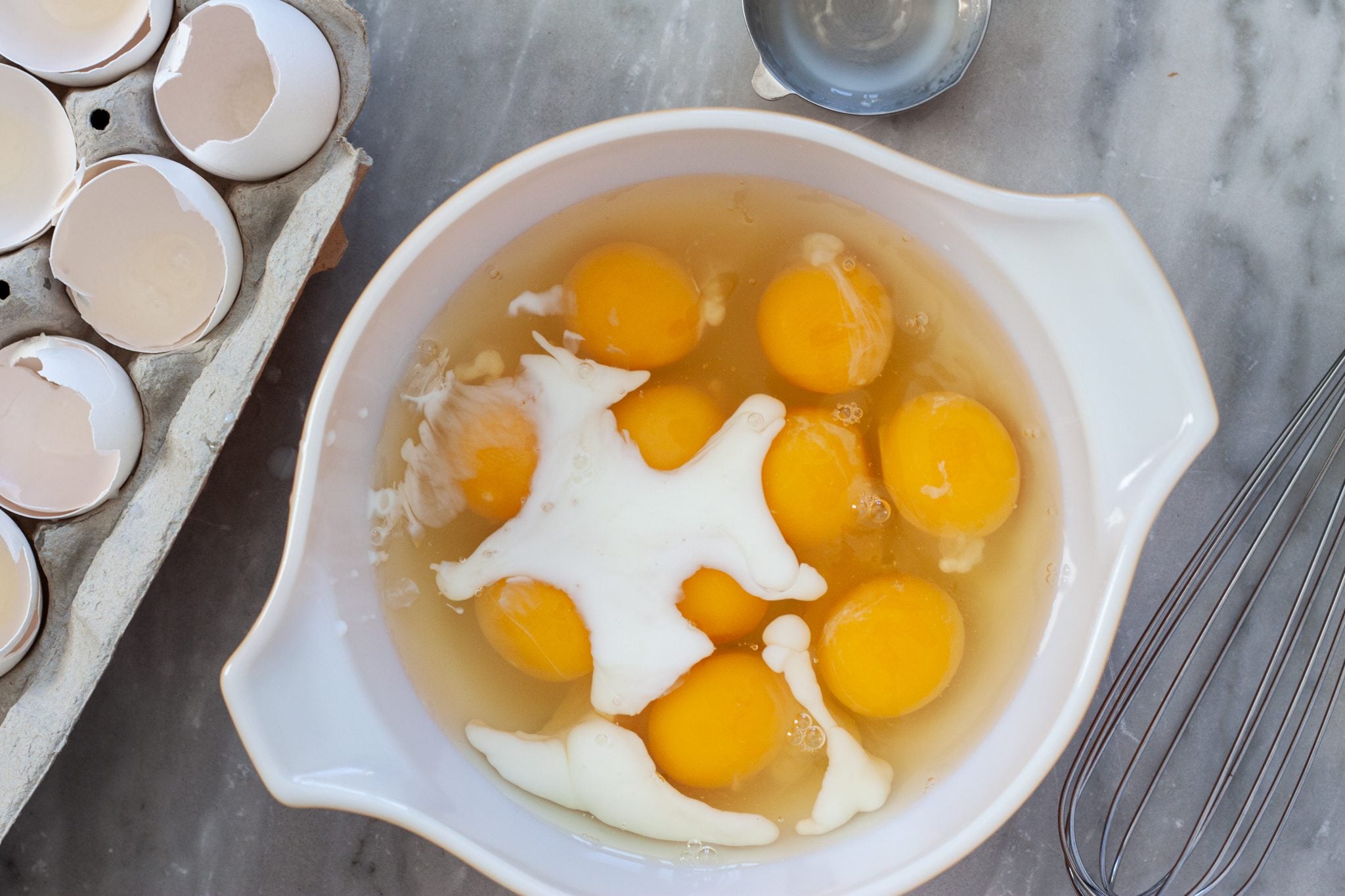 eggs in a bowl with milk.