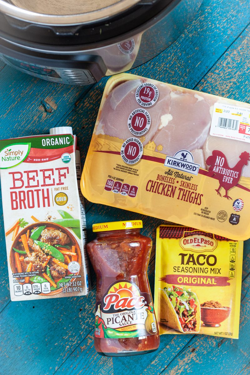 Ingredients for Instant Pot Salsa Chicken, including chicken, salsa, taco seasoning, and a cooking liquid