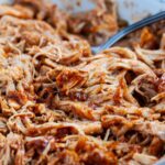 Shredded instant pot salsa chicken in a bowl.