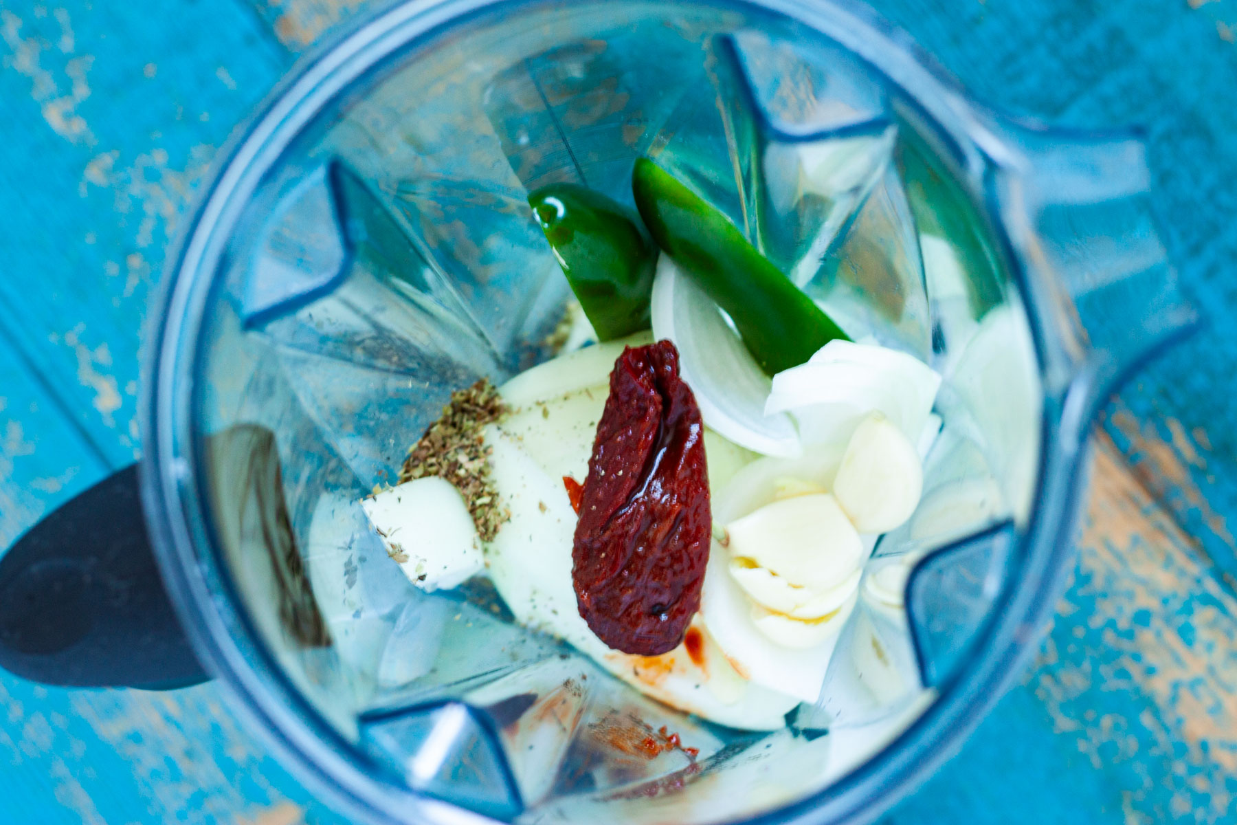 onion, garlic jalapeno, oregano, chipotle en adobo in a blender.