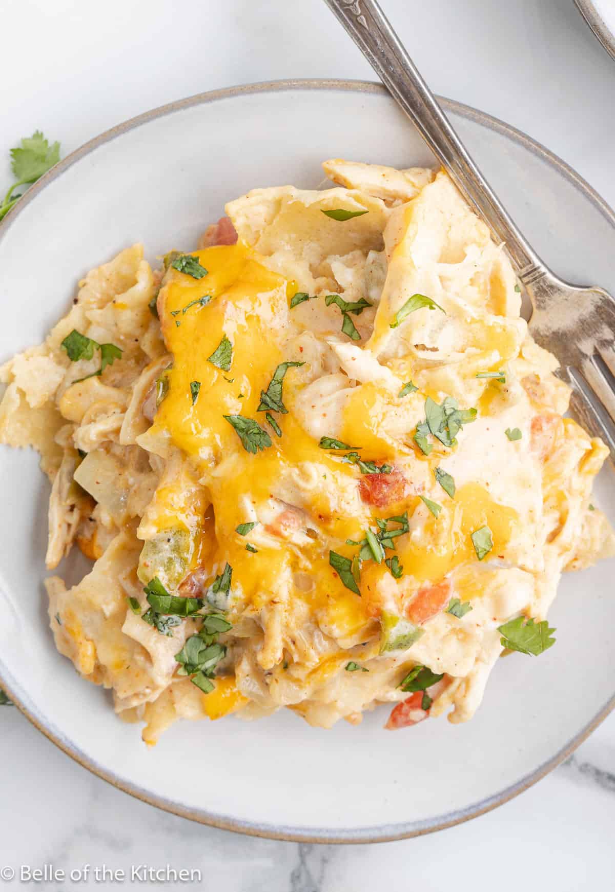 king ranch chicken casserole on a plate with a fork