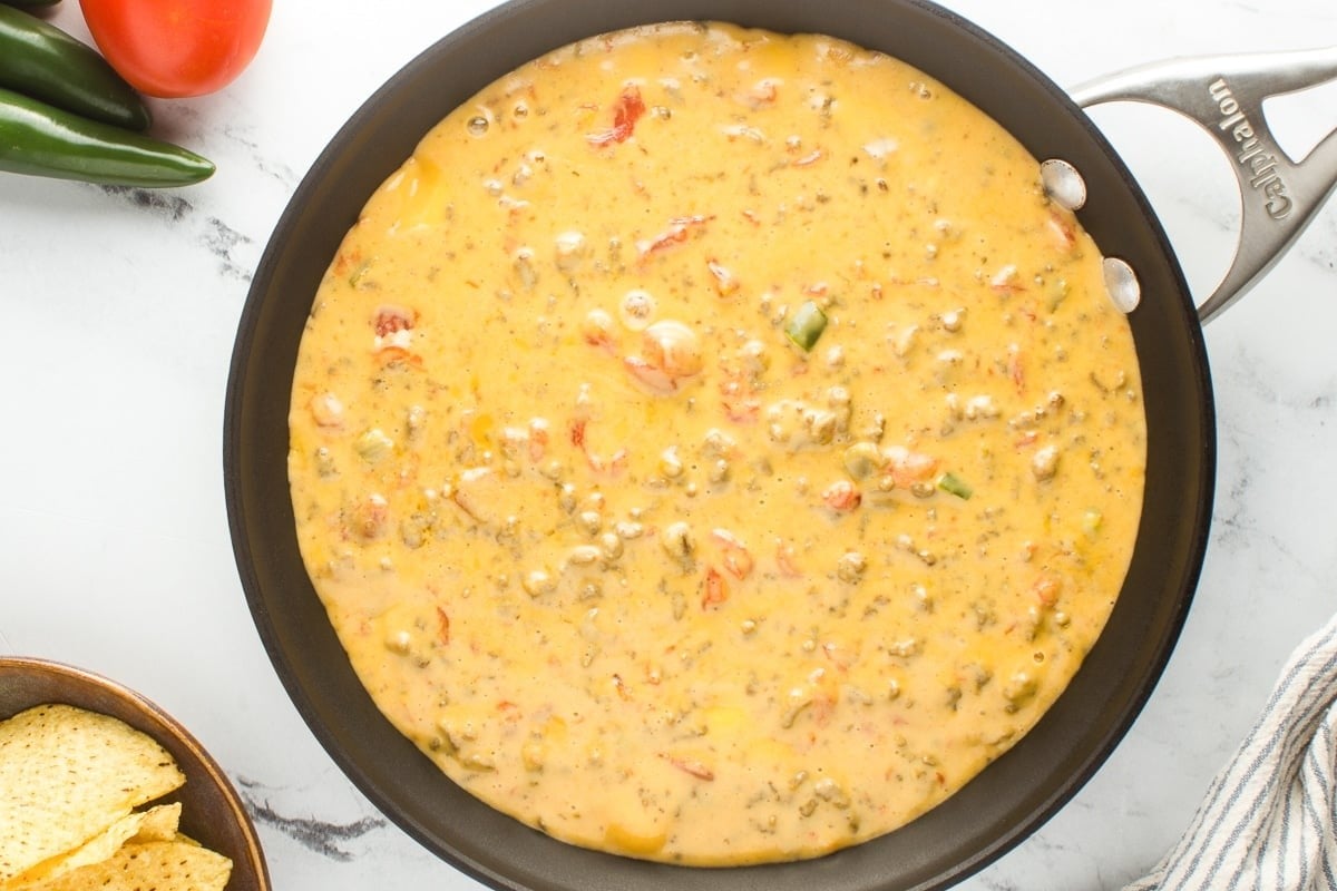 beefy rotel dip in a sauce pan.