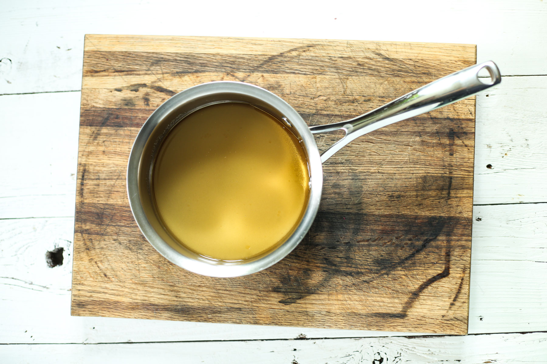 apple cider vinegar salad dressing in a saucepan.