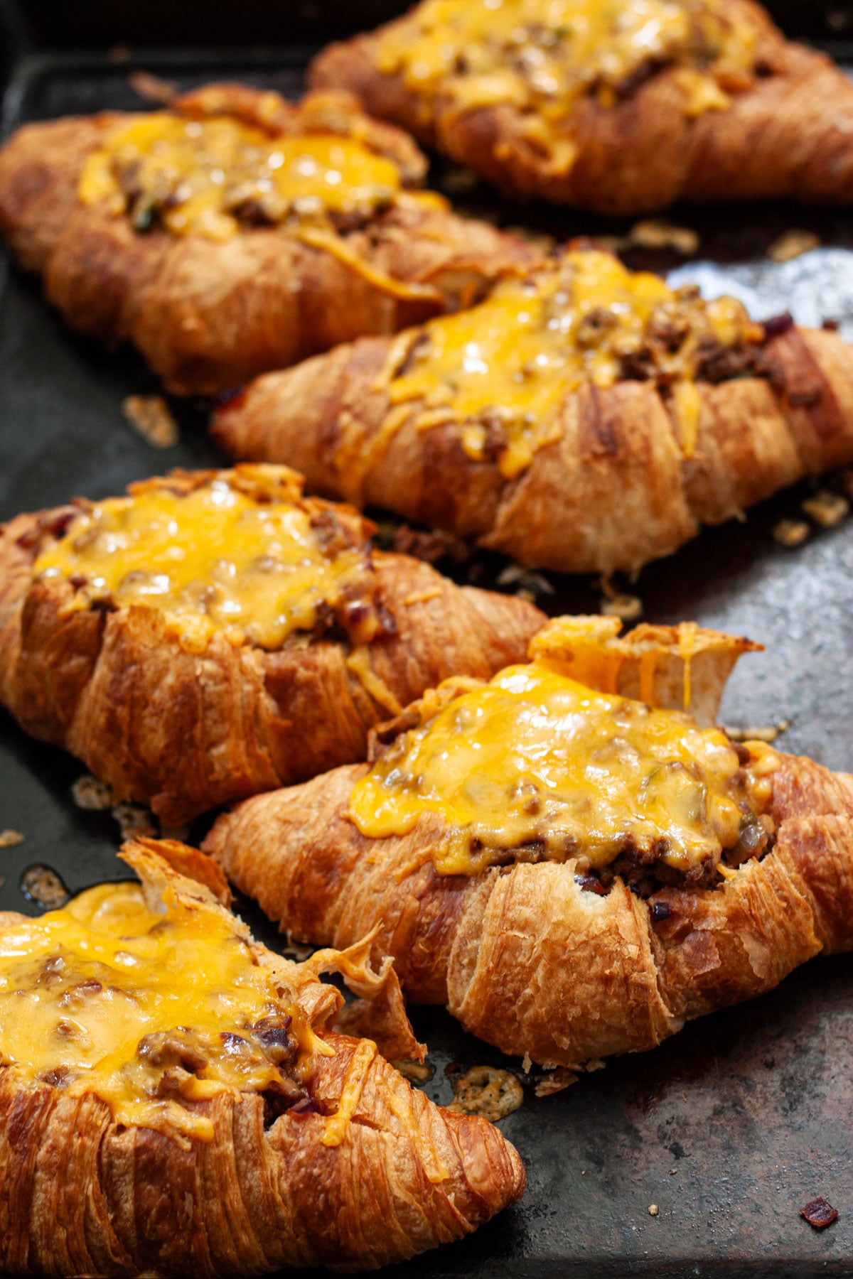 fresh croissant tacos from the oven covered in melty cheese.
